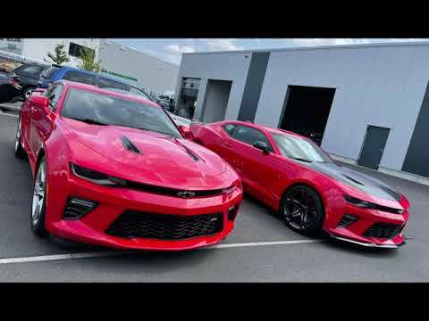 Unloading 2 Camaro in red - one 2SS, one 1LE Track Pack (HQ).jpg